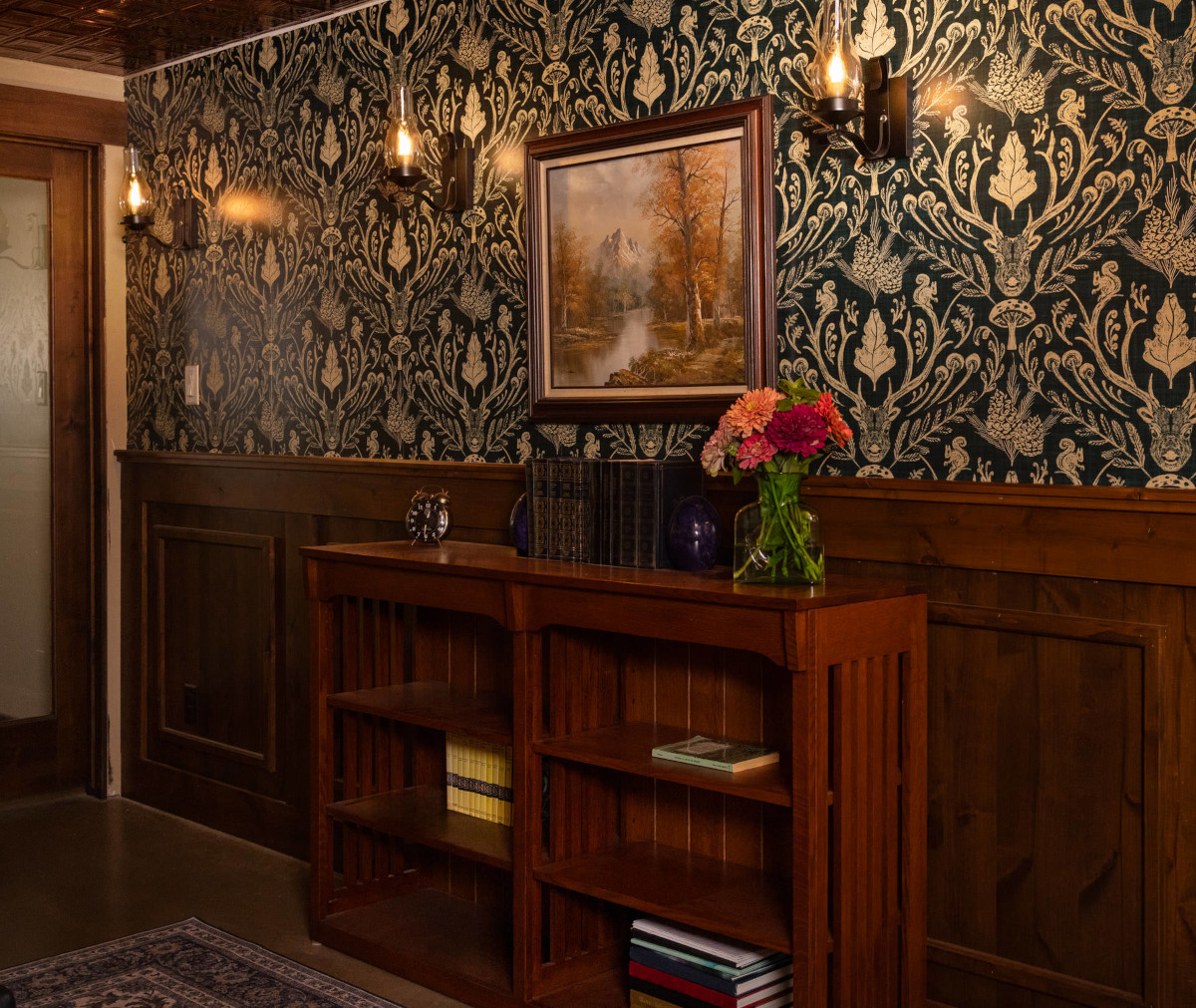 Ornately wallpapered library